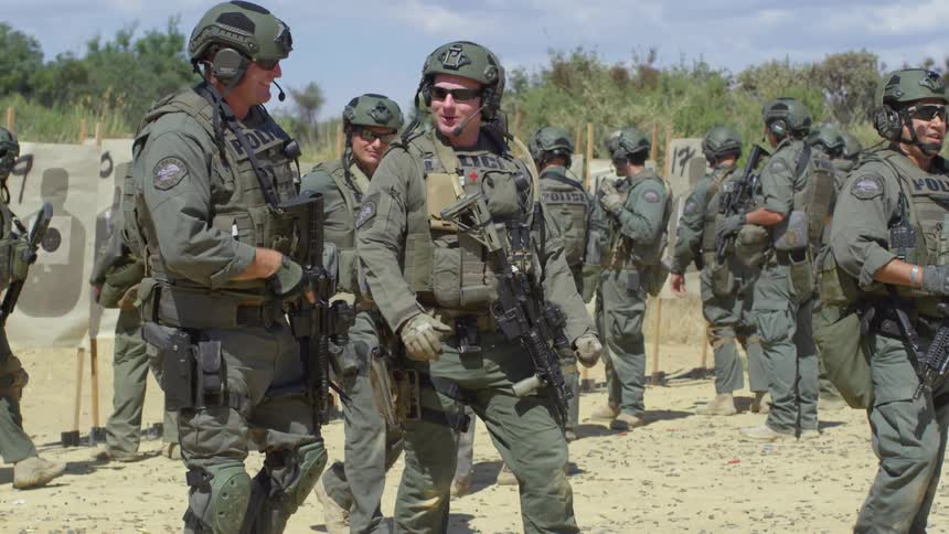 Police officers in military gear in a training exercise