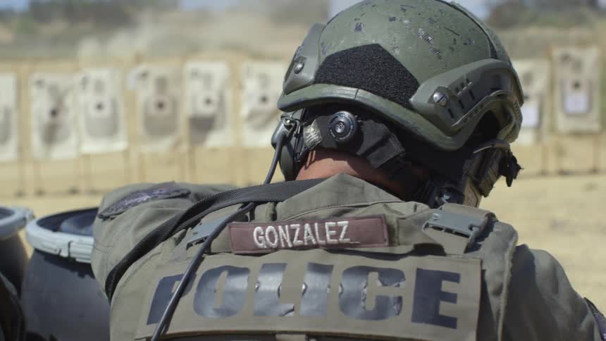 Two military police shoot at paper targets