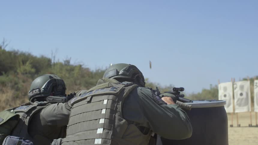 Military police shooting at paper targets