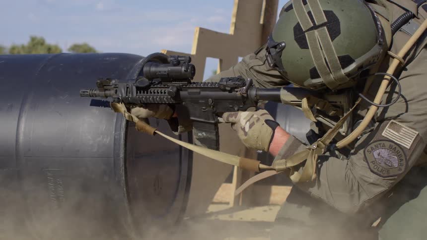 A military police shoots a rifle