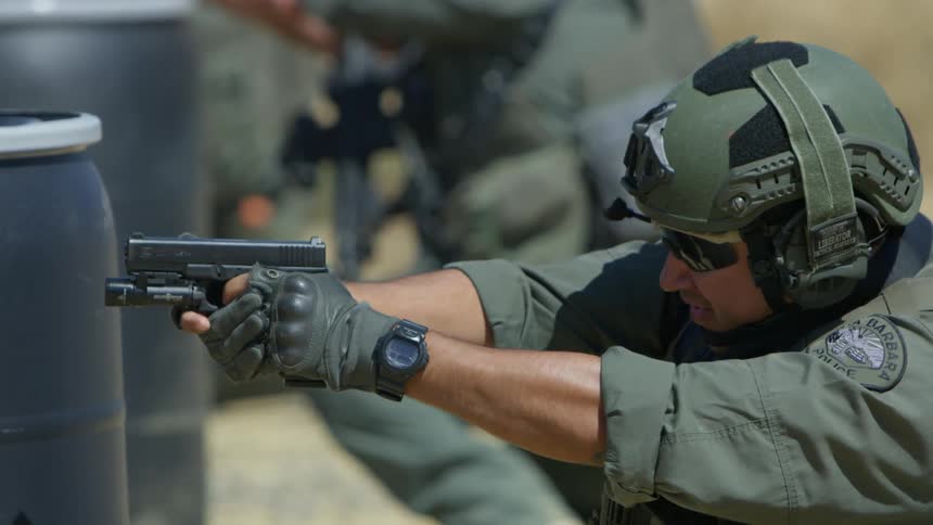 Police are firing off their weapons in a line