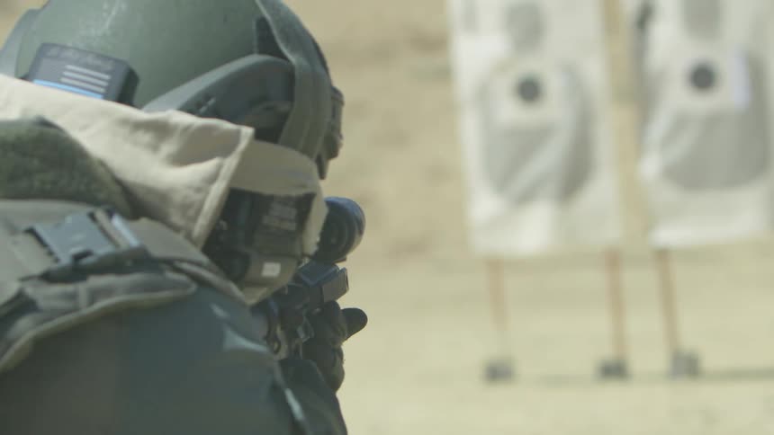 A soldier shoots at targets