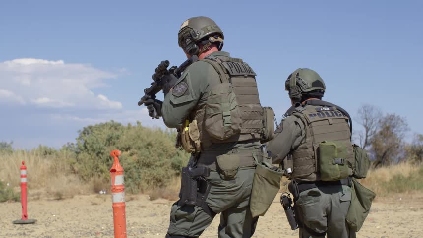 Police officers in military gear on a training exercise