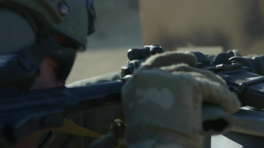 A military police fires shots and then walks away