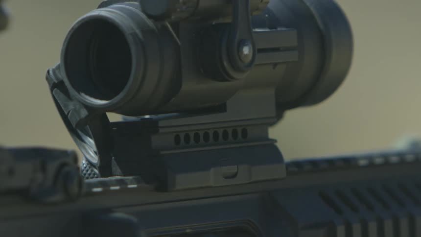 A scoped rifle is fired