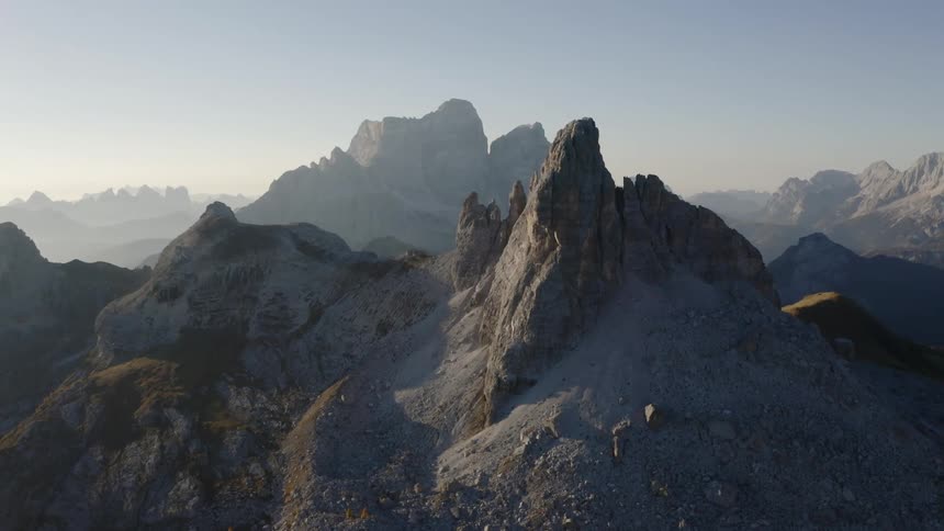 Fog sets over the peaks of a mountain range