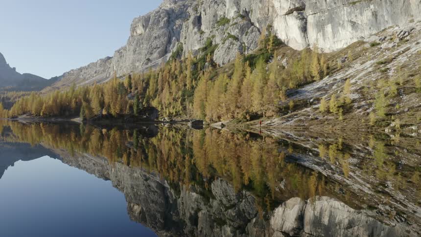 A landscape view is displayed and reflected in the water