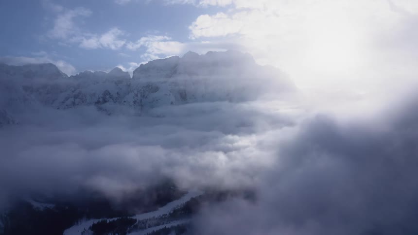 Mountains covered in snow are displayed