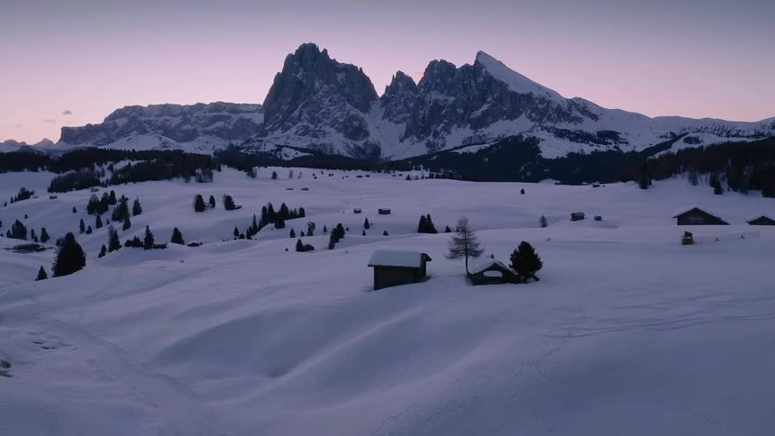 A mountain covered in snow is displayed