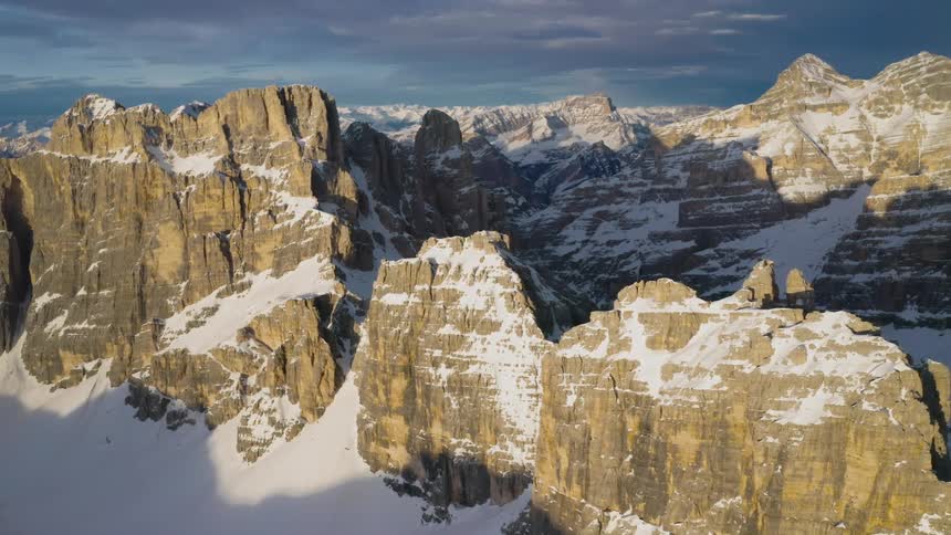 Aerial view of snowy steep mountains