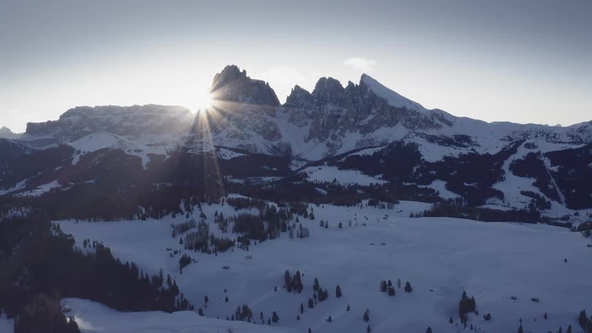 A snow covered mountain with the sky in the background