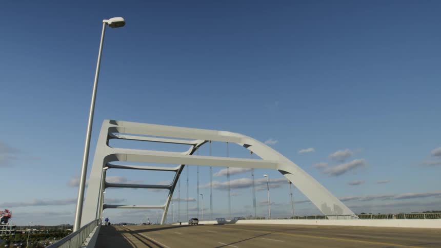 A vehicle drives across a bridge