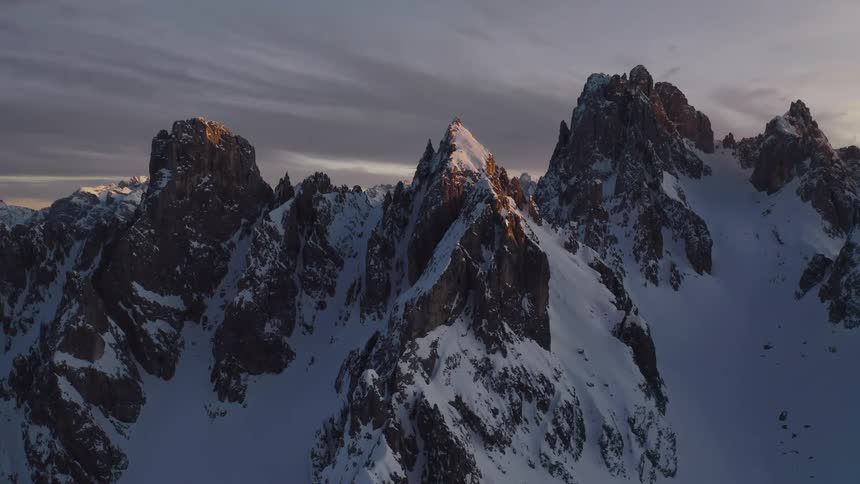The mountain range is covered with snow