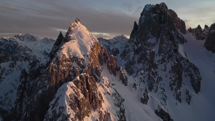 Aerial view of snow covered mountains