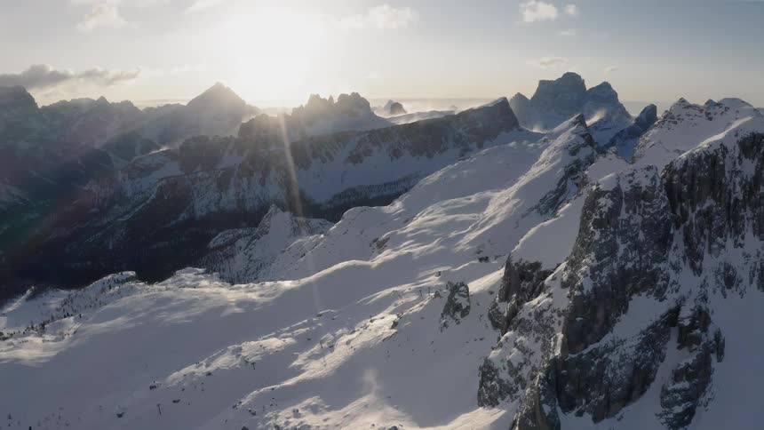 The tall mountain is covered with snow