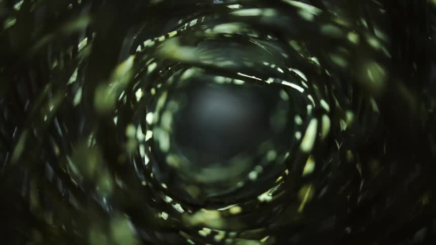 Light shimmers and shines on a woven rolled tunnel
