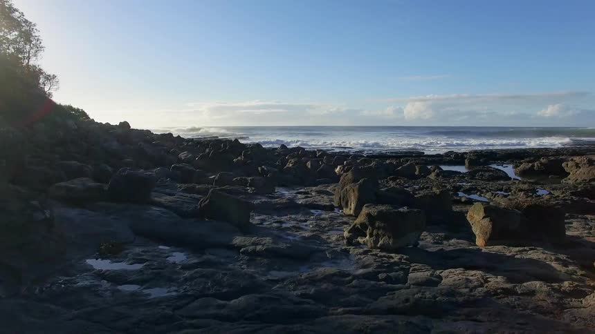 Waves crashing against a rocky shoreline