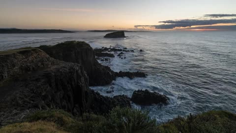Timelapse of a shoreline during sunrise