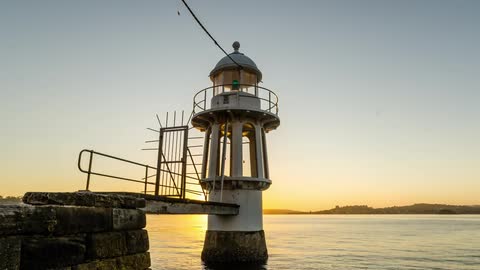 Timelapse of harbour lighthouse at Sunrise