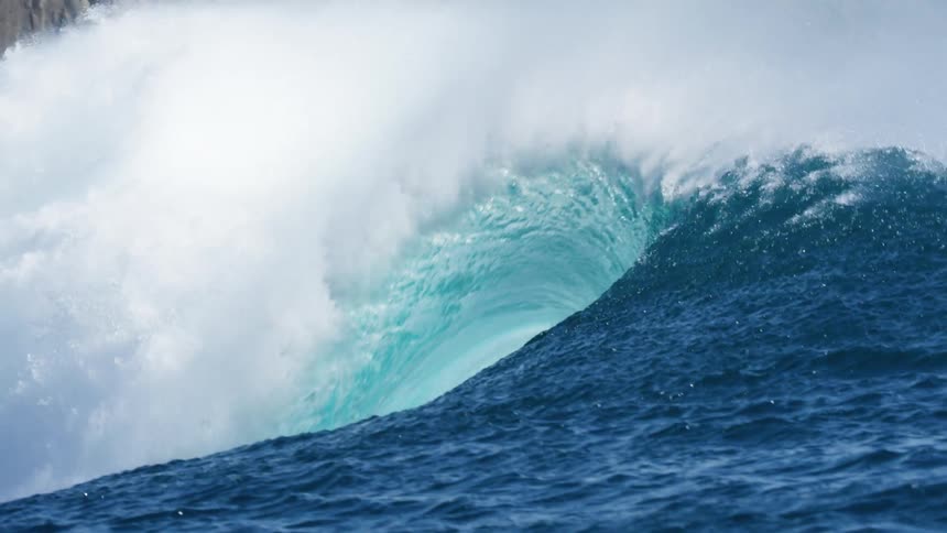A giant wave breaks off the coast
