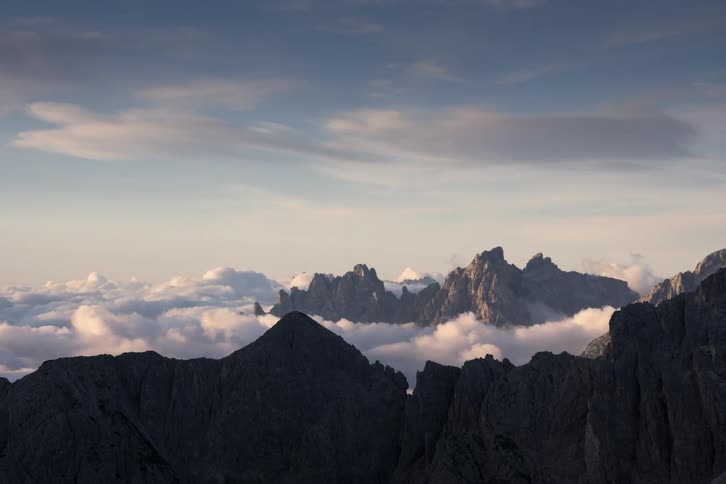 Time lapse of clouds moving over a mountain top