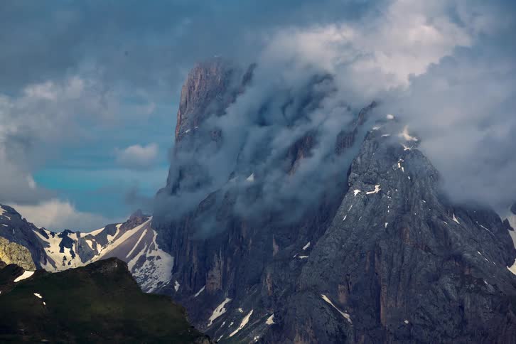 Large plumes of steam rise from a Marmolada - Dolomites Mountains Italy