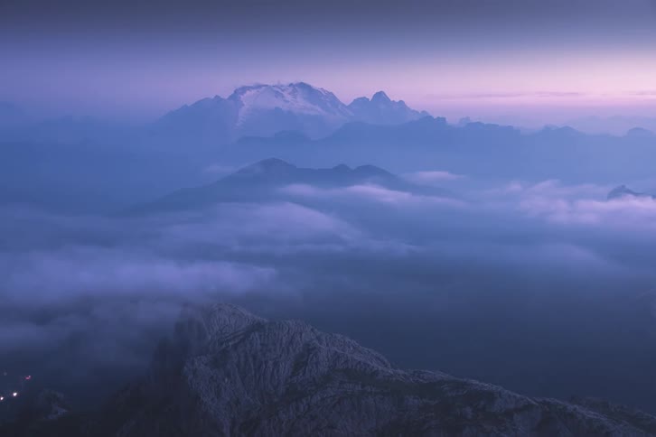 Marmolada - Dolomites Mountains with clouds and the sky in the background