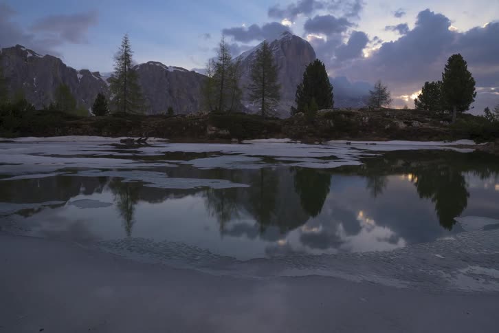 Ice on a lake is just starting to melt as spring arrives
