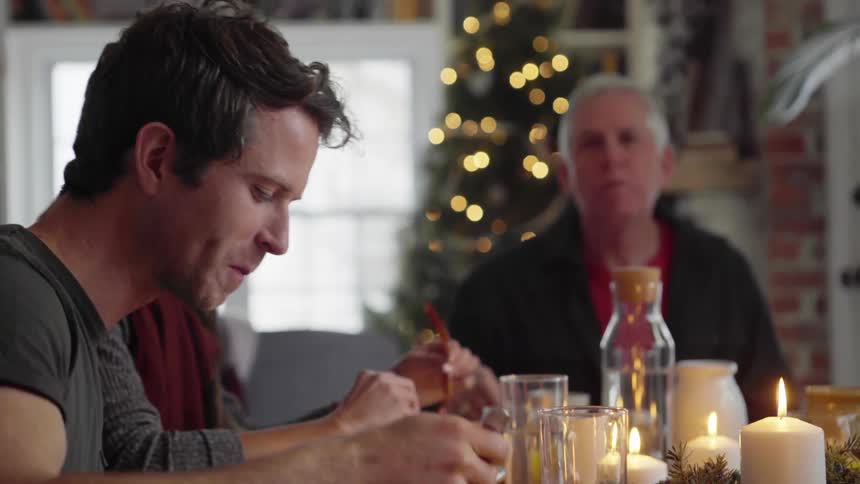 Family eats a christmas meal at home