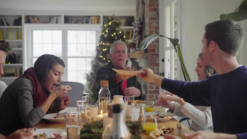 Family eats christmas lunch at home