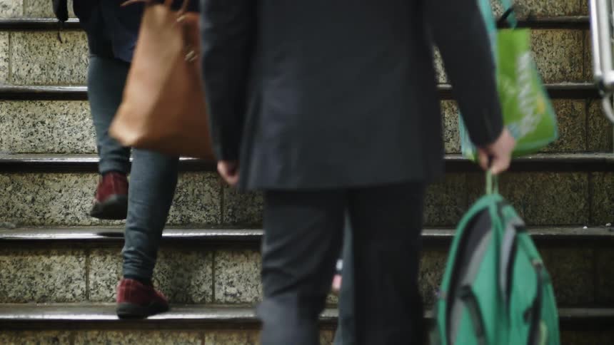 People walking up a flight of stairs