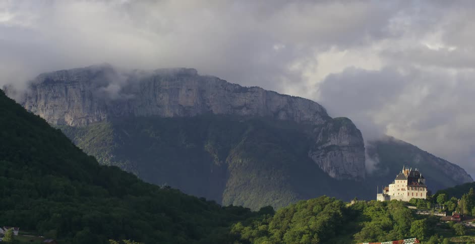 A building in front of a mountain