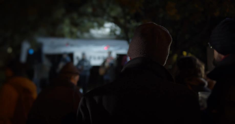 People are watching a band play outside