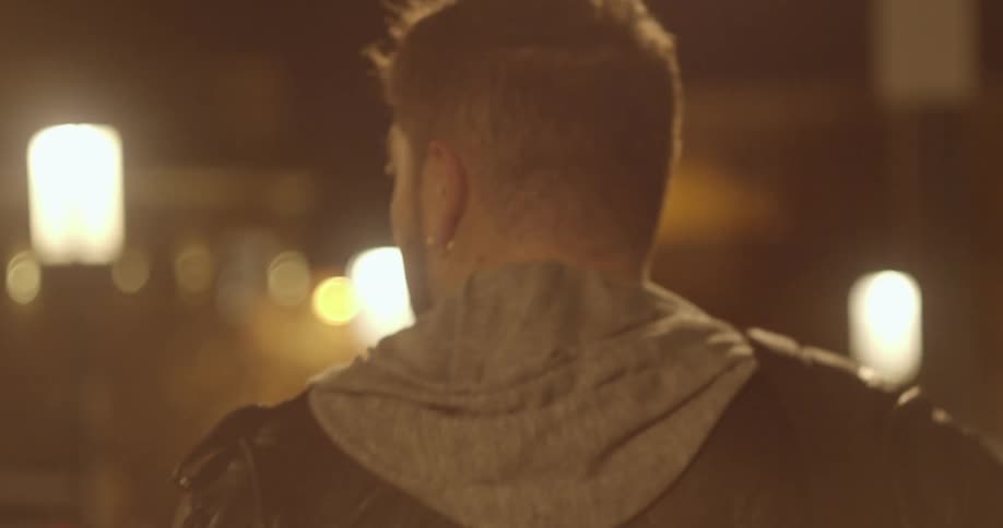 A man walking outside at night