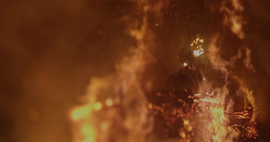 A large fire burns outdoors
