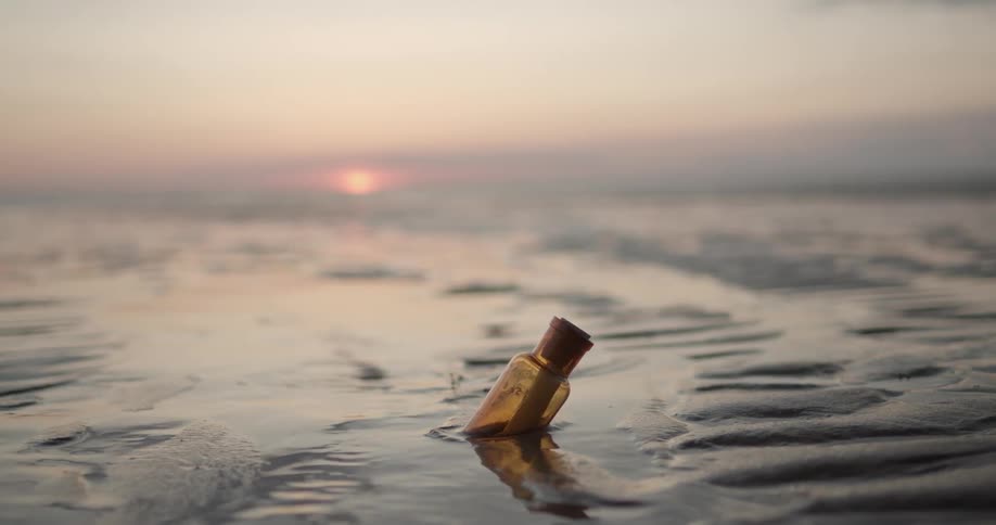 A message in a bottle sitting in the water