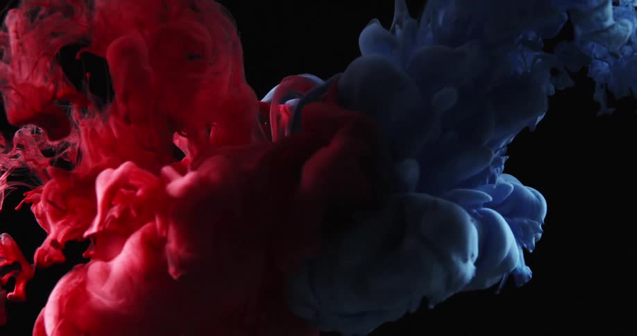 Blue and red ink flowing in a water tank