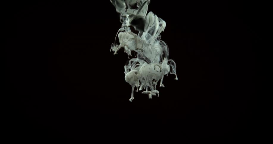 White black and gray colors that look like paint mixing with water
