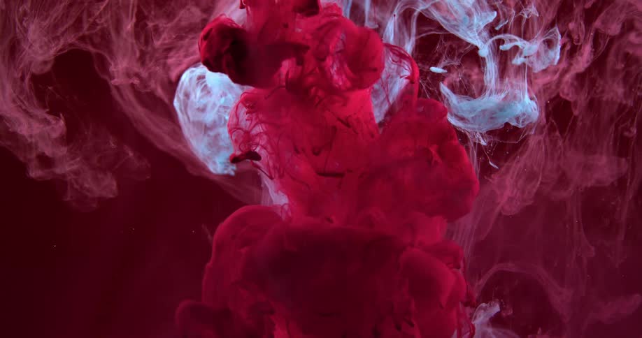 Different colored fluids mix together in a solution
