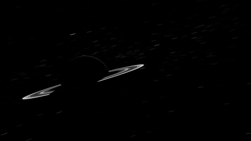 Shadow flows over planet with rings moving past distant stars as it orbits