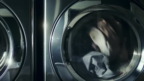 Laundry tumbles around in a washing machine