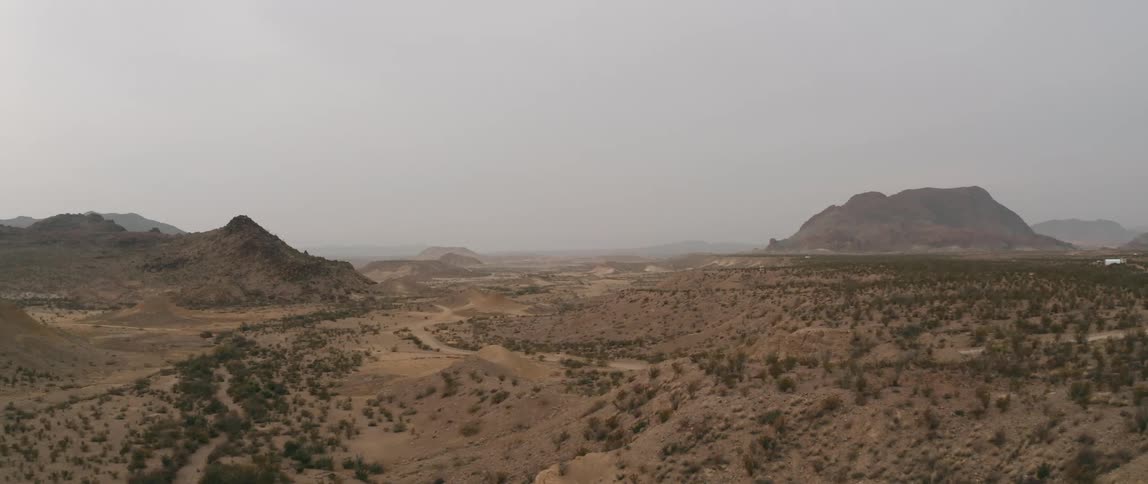 Aerial view of mountains surrounded by fog on the badlands
