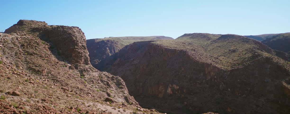 Canyon between hills in the badlands at morning