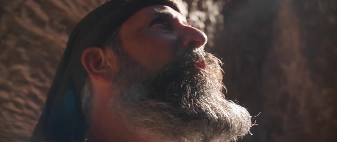 A man looks up towards the sky