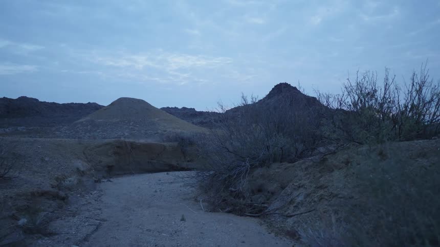 Landscape view of a dirt path in a barren area