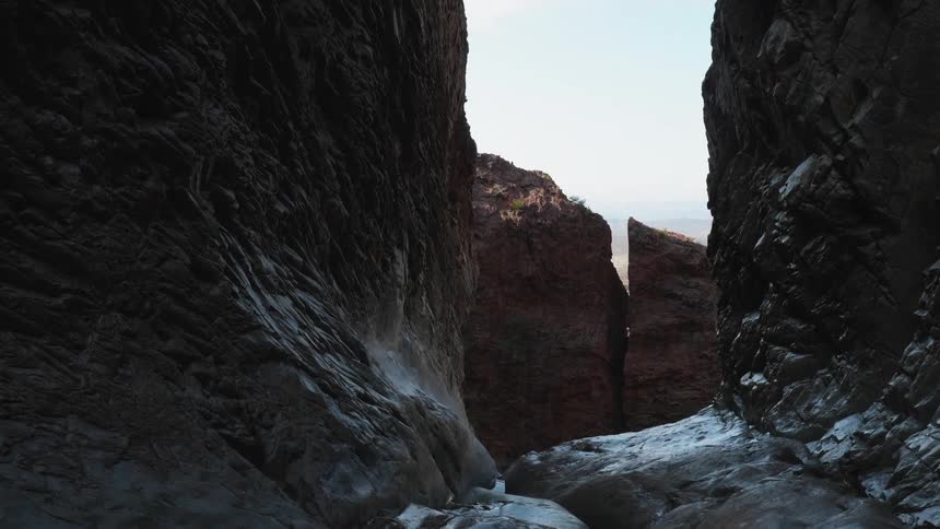 A creek flowing in between canyons