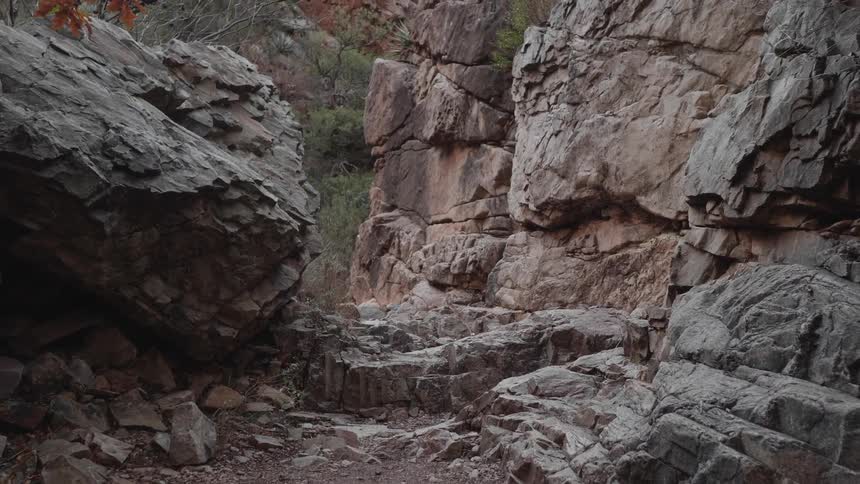 Mountain pass on a cliff side through a mountain in the desert