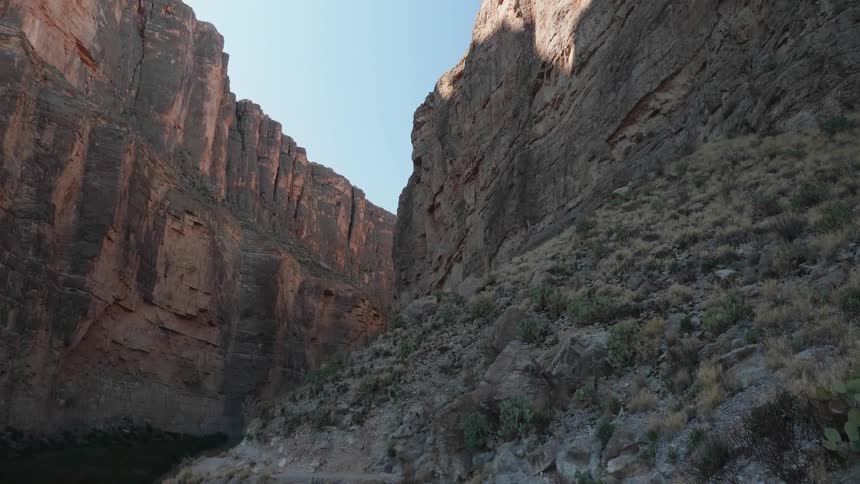 A river running through a canyon on a sunny day