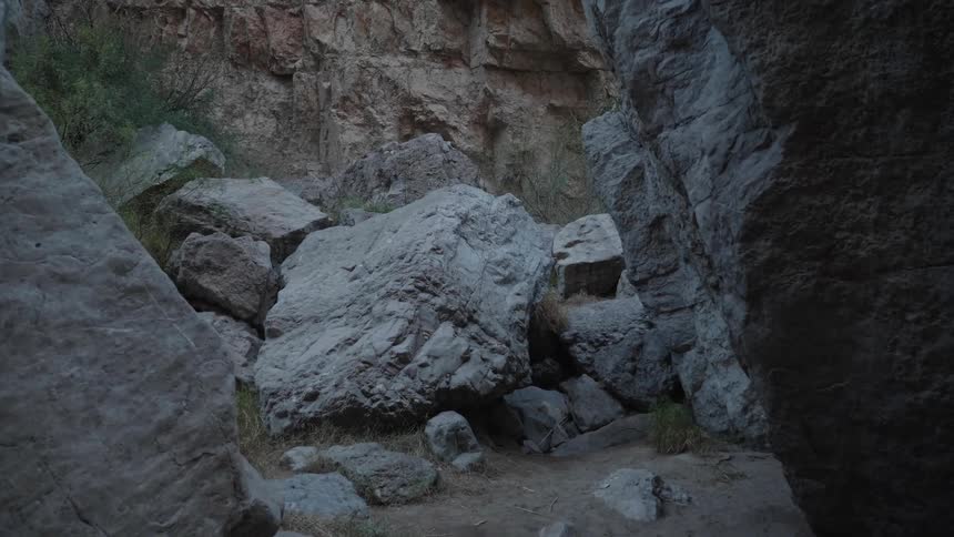 Big rocks and boulders inside a canyon between the mountains