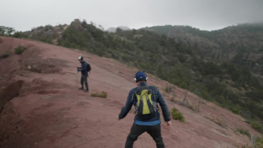 Two men are hiking outdoors